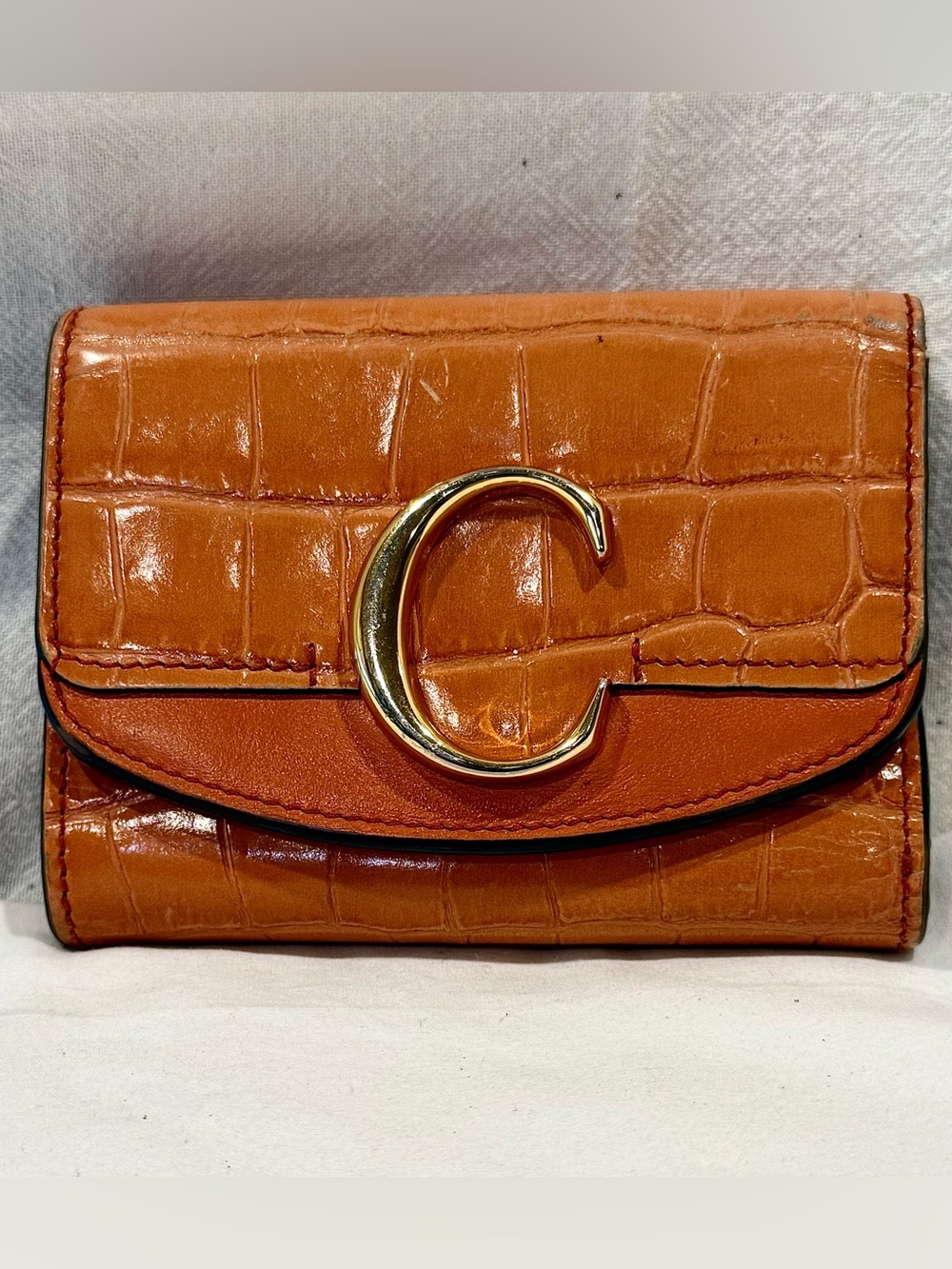 Chloé “C” Small Trifold Wallet In Tawny Orange Crocodile Embossed Leather
